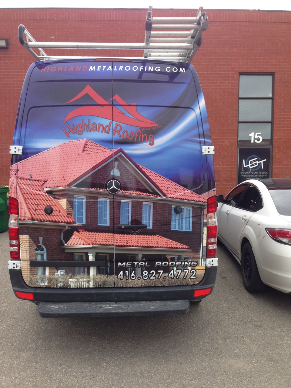 Highland Roofing van wrap, rear view